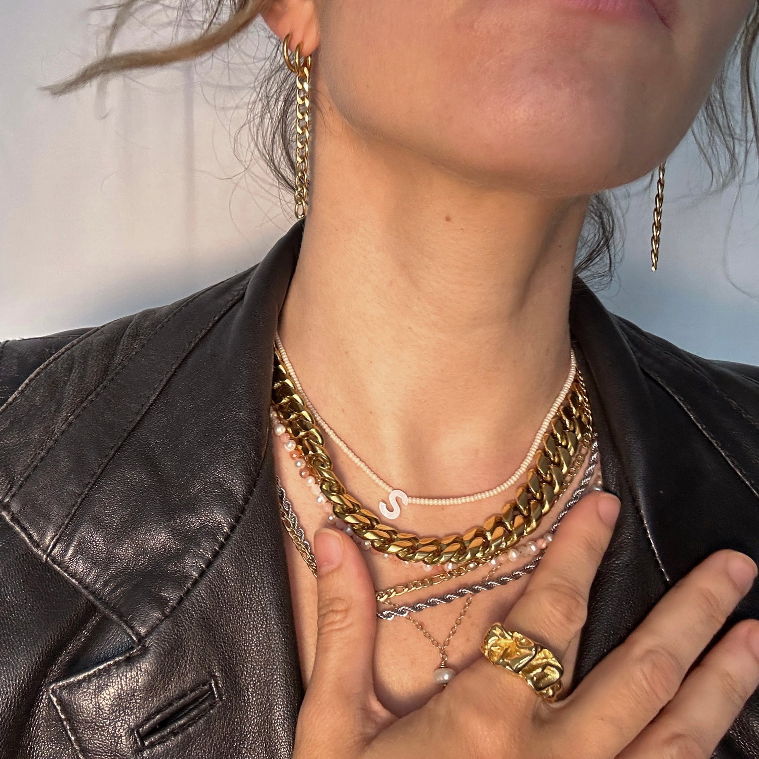 Necklace stack, gold, silver, pearls, editorial picture